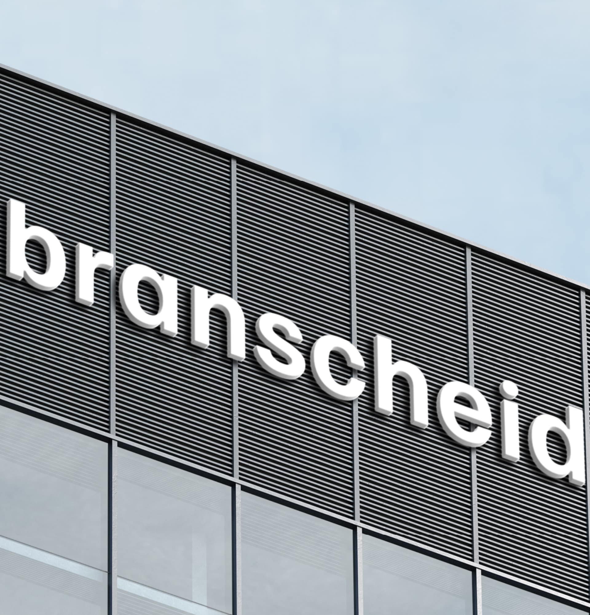 Gebäude mit "Branscheid"-Logo auf Fassade, modernes Design.